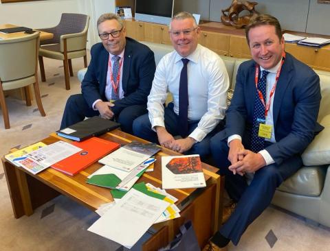 Iain MacKenzie, Minister Murray Watt and Andrew Gissing talking on couch.