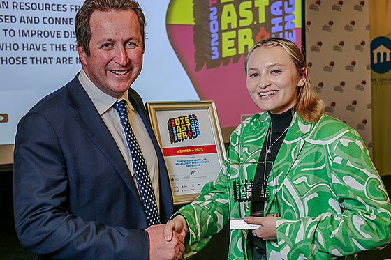 Natural Hazards Research Australia CEO Andrew Gissing presenting Lydia Wardale, the winner of the 2023 Disaster Challenge, with her certificate and trophy.