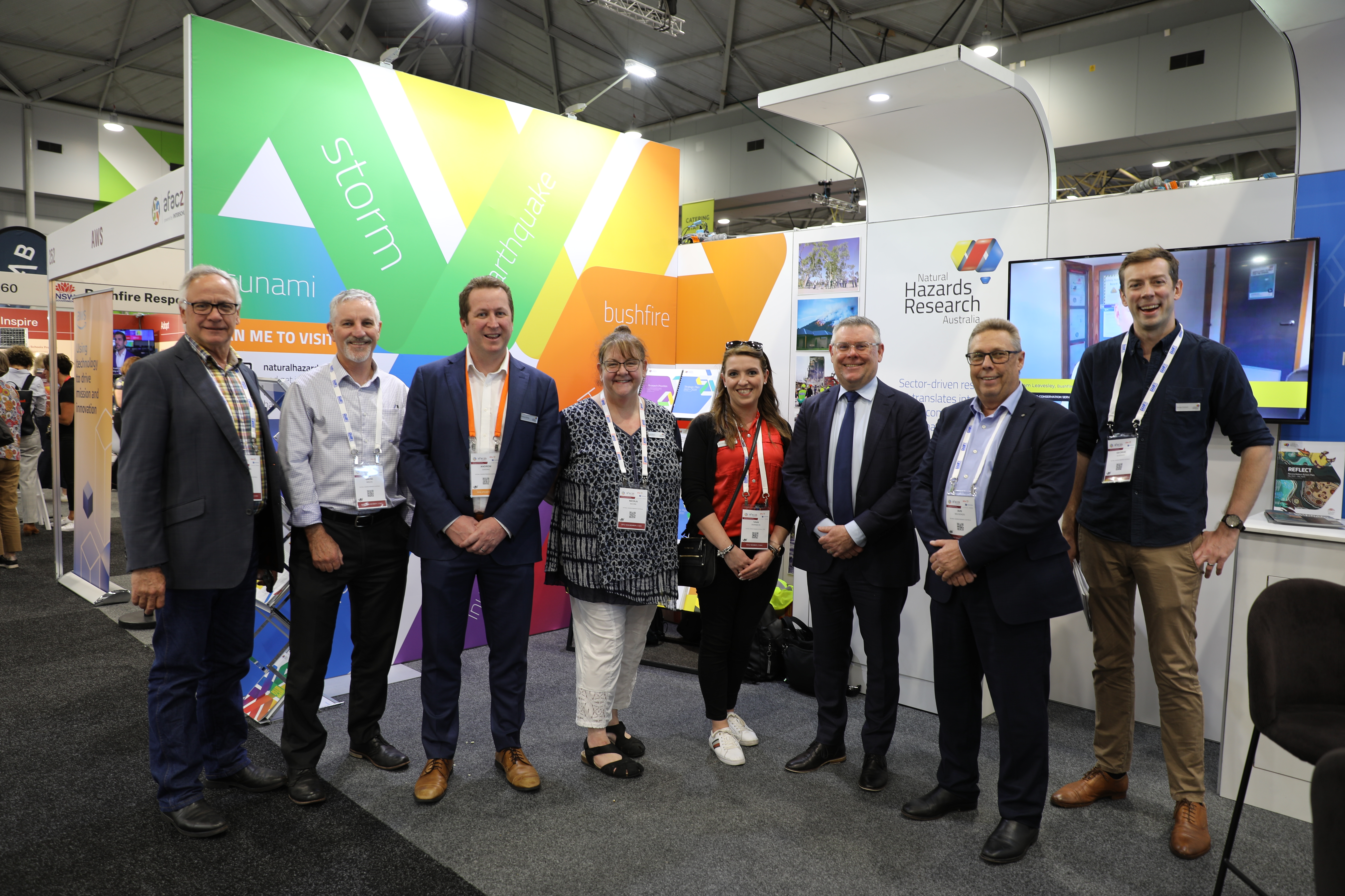 A photo of Minister Murray Watt with NHRA staff at their AFAC23 booth.